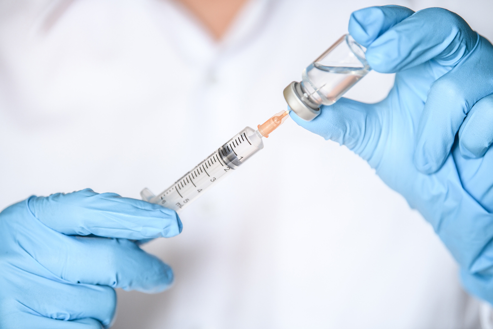Doctor,,Nurse,,Scientist,Hand,In,Blue,Gloves,Holding,Flu,,Measles,